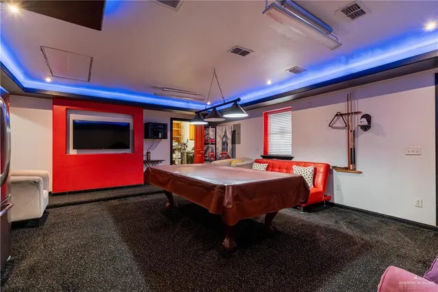 a bed room with a bed and a chandelier