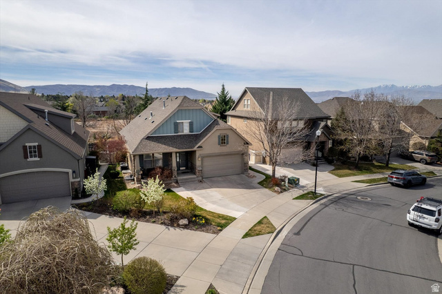 1456 Firelight Way Sandy, UT 84092 - Photo 1 of 22 View of front of property with a mountain view, a residential view, concrete driveway, and a garage