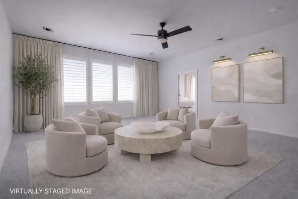 a living room with furniture and a large window