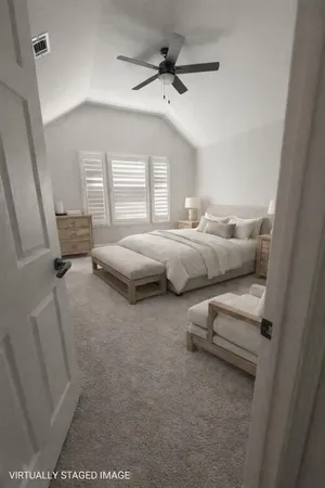 a living room with furniture and a ceiling fan