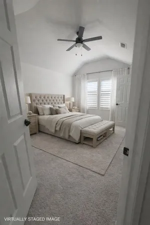 a bedroom with a bed and window