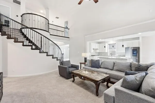 a living room with furniture and a rug