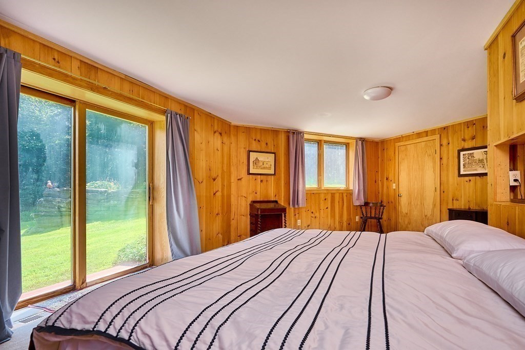 90 Patterson Road Worthington, MA 01098 - Photo 20 of 30 a bedroom with a large bed and a large window