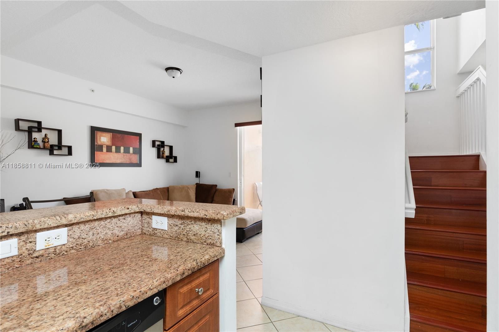1068 Southwest 143rd Avenue, Unit 2510 Pembroke Pines, FL 33027 - Photo 19 of 49 a kitchen with granite countertop a sink and a stove
