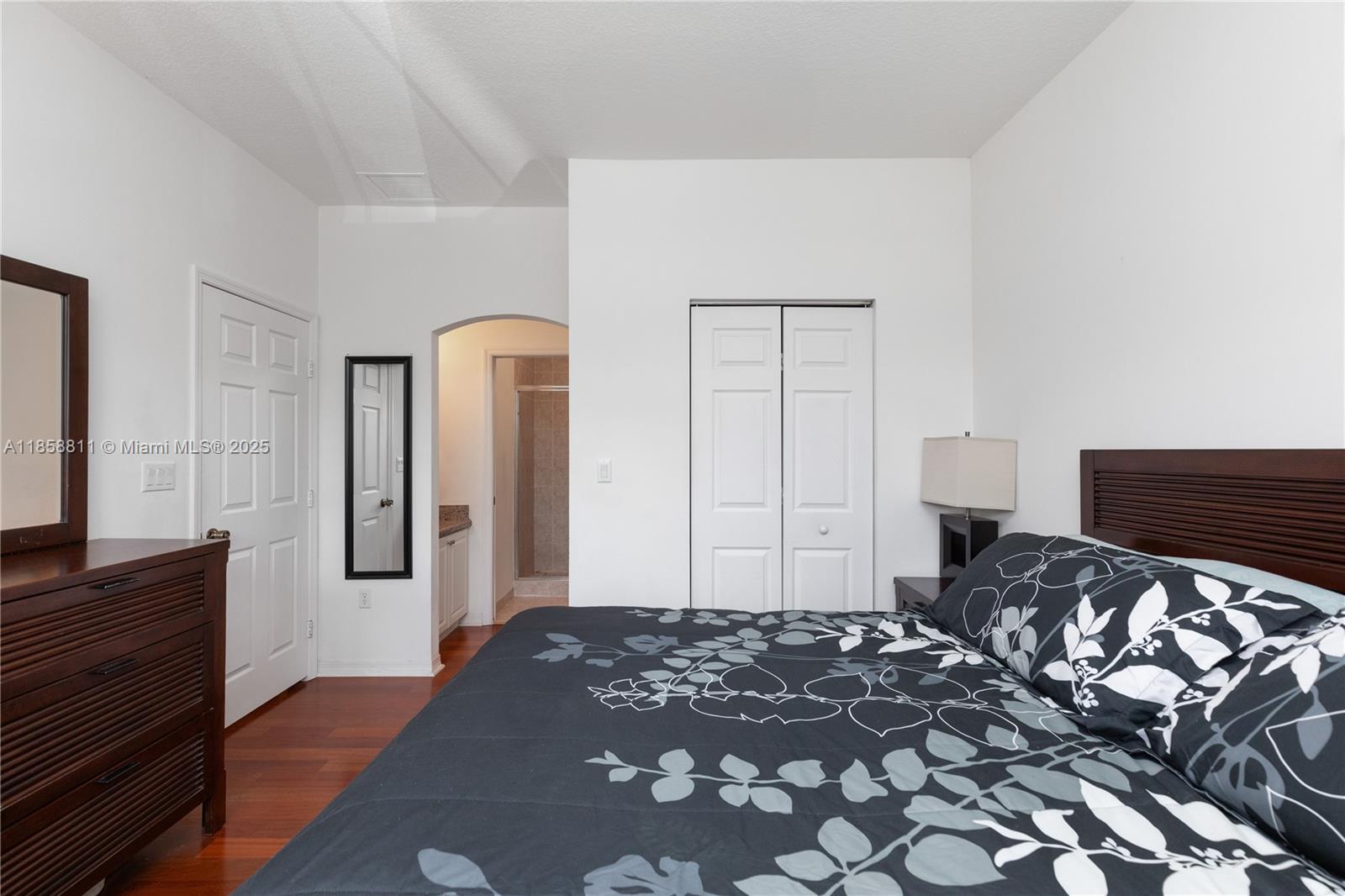 1068 Southwest 143rd Avenue, Unit 2510 Pembroke Pines, FL 33027 - Photo 23 of 49 a bedroom with a bed and a flat screen tv