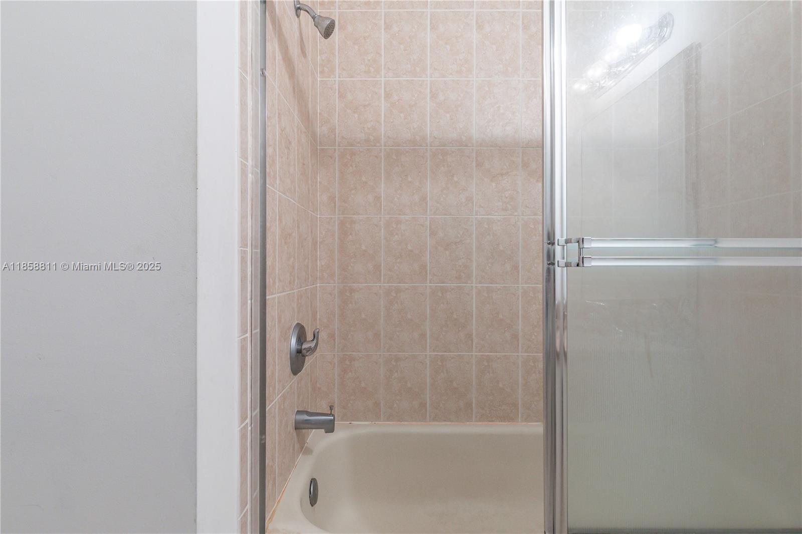 1068 Southwest 143rd Avenue, Unit 2510 Pembroke Pines, FL 33027 - Photo 27 of 49 a bathroom with a bathtub