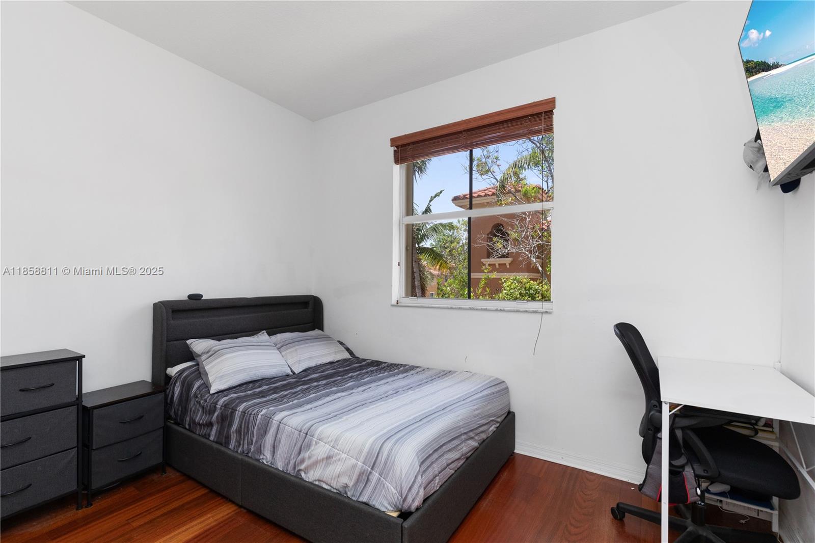 1068 Southwest 143rd Avenue, Unit 2510 Pembroke Pines, FL 33027 - Photo 28 of 49 a bedroom with a bed and a window