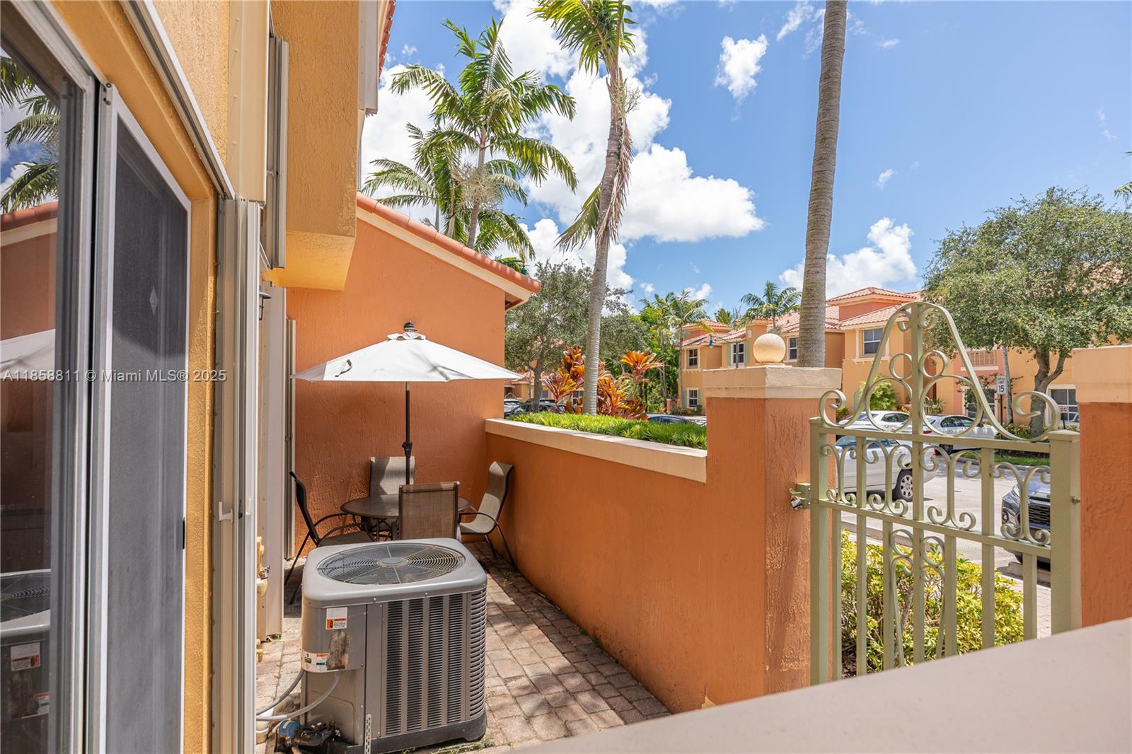 1068 Southwest 143rd Avenue, Unit 2510 Pembroke Pines, FL 33027 - Photo 38 of 49 a view of a balcony with an outdoor space