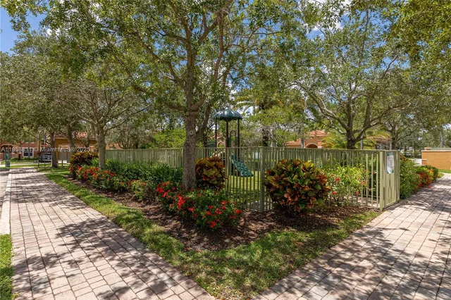 a view of a patio with swimming pool and sitting area