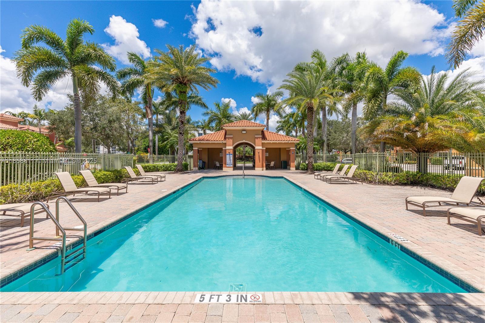 1068 Southwest 143rd Avenue, Unit 2510 Pembroke Pines, FL 33027 - Photo 47 of 49 a swimming pool with outdoor seating and yard
