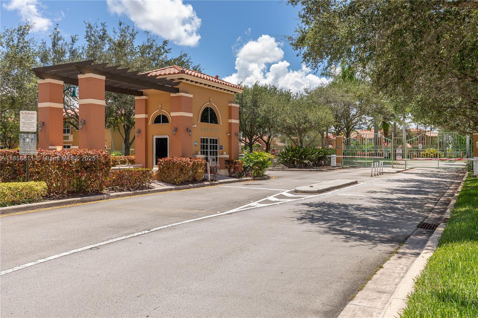 1068 Southwest 143rd Avenue, Unit 2510 Pembroke Pines, FL 33027 - Photo 49 of 49 a front view of a house with a yard and trees