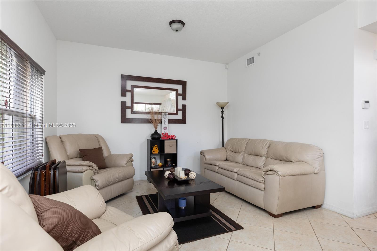 1068 Southwest 143rd Avenue, Unit 2510 Pembroke Pines, FL 33027 - Photo 7 of 49 a living room with furniture and a couch
