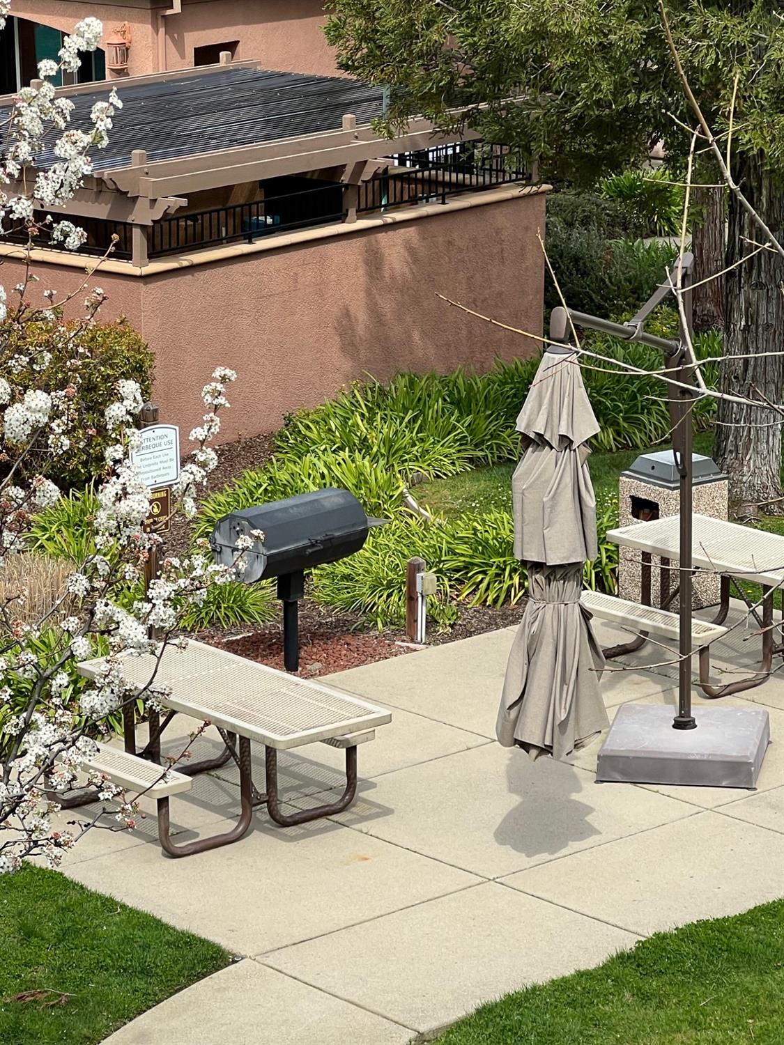 a picture of table and chairs with wooden fence