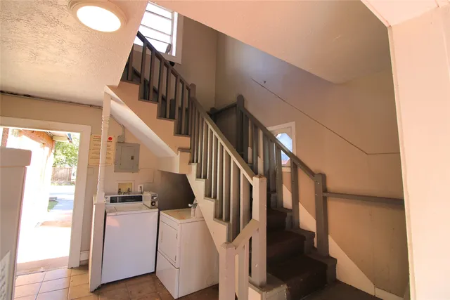 a view of a backyard with large trees