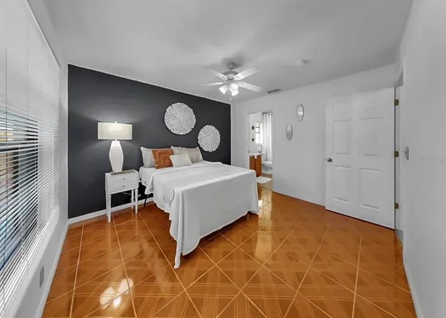 a bed room with a bed and a table