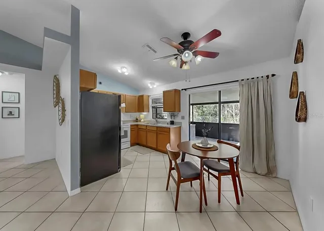 a kitchen with stainless steel appliances granite countertop sink stove top oven and cabinets