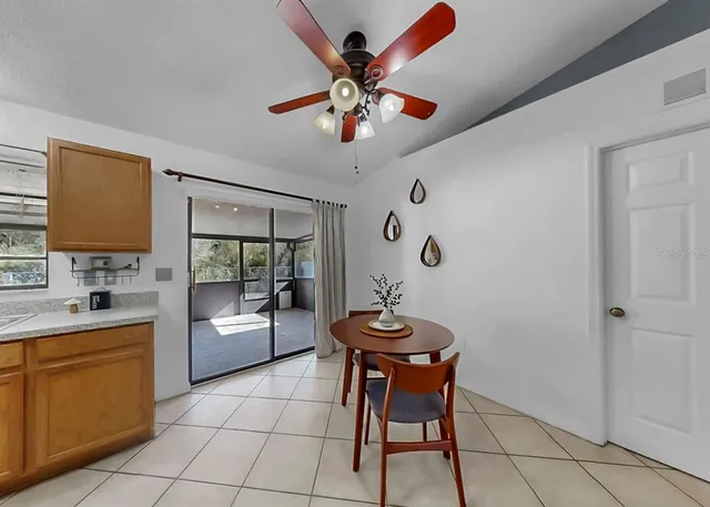 a kitchen with stainless steel appliances granite countertop a refrigerator sink and cabinets
