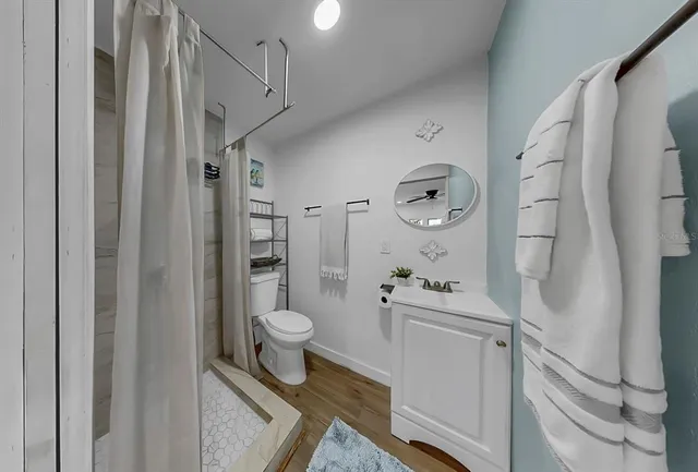 wooden floor in a hall with a window