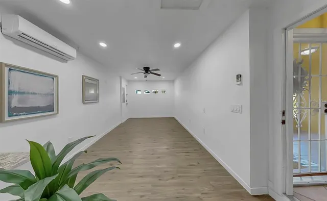 a bedroom with a bed couch and window