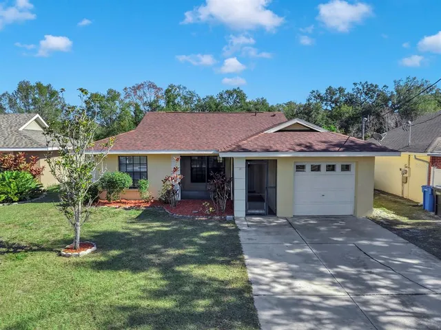 a view of a house with a yard porch and sitting area