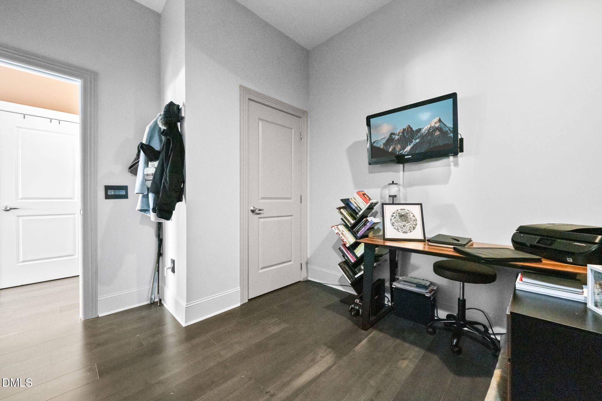 400 West North Street, Unit 1218 Raleigh, NC 27603 - Photo 24 of 41 a view of a workspace with wooden floor and white cabinet