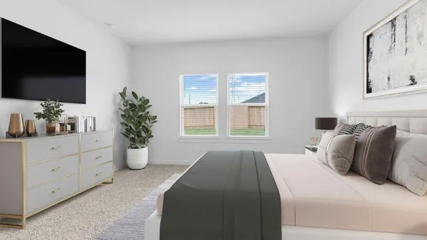 a spacious bedroom with a large bed and a flat screen tv