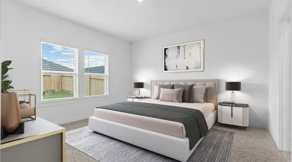 a spacious bedroom with a bed and a couch