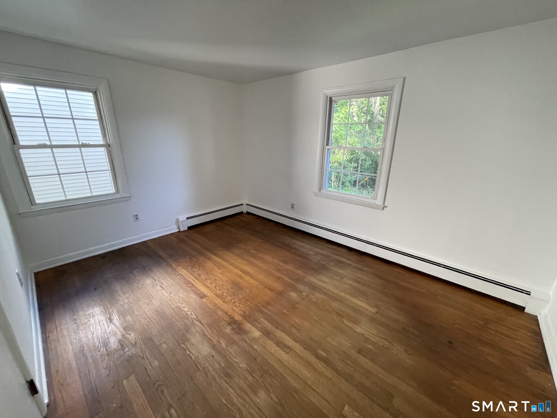 8 Prospect Hill Deep River, CT 06417 - Photo 12 of 16 an empty room with wooden floor and windows