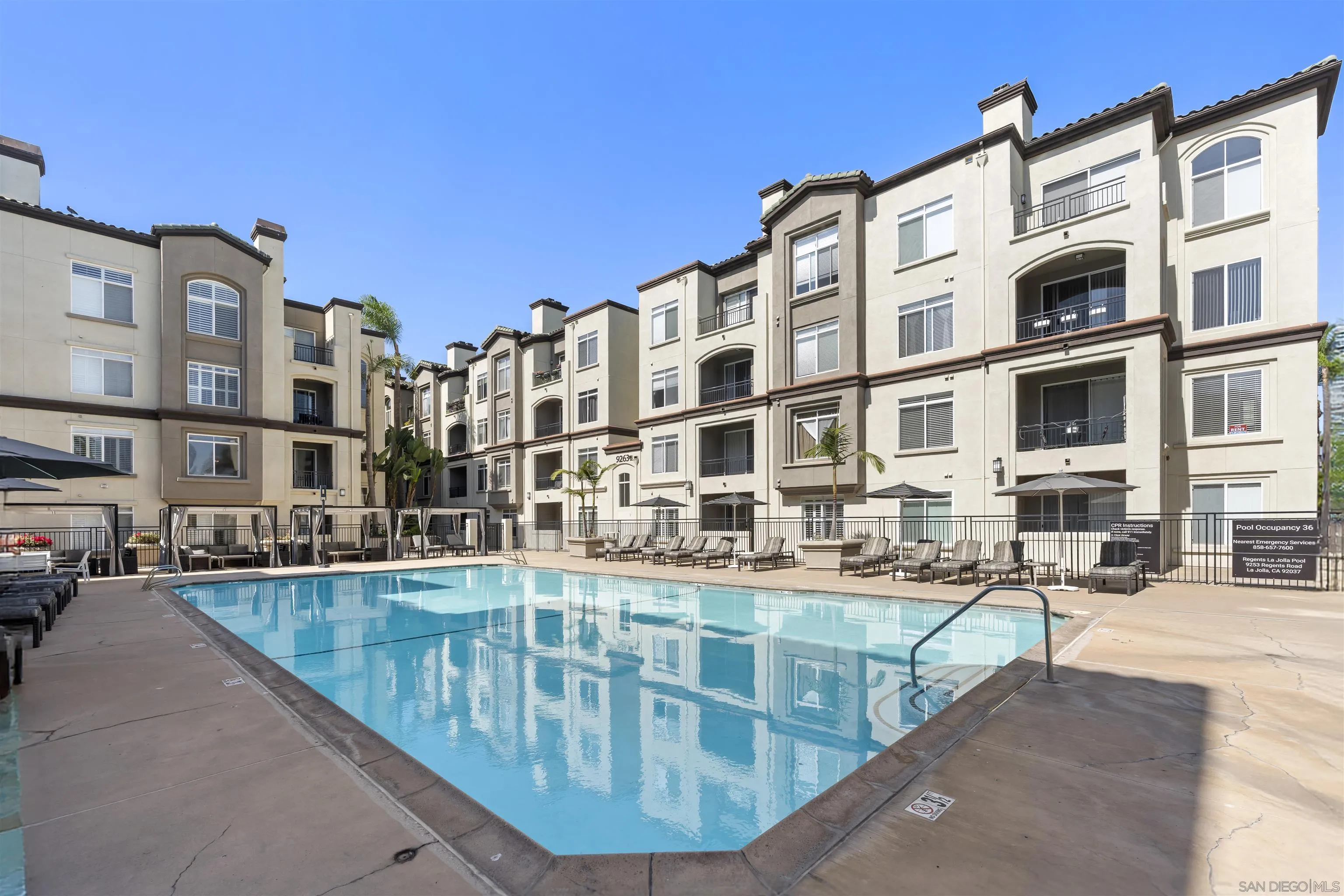 9293 Regents Road, Unit C108 La Jolla, CA 92037 - Photo 26 of 47 Enjoy resort-style living in the gated Regents La Jolla community featuring two heated pools, two hot tubs with lounge furniture, cabanas, and a large outdoor BBQ area.