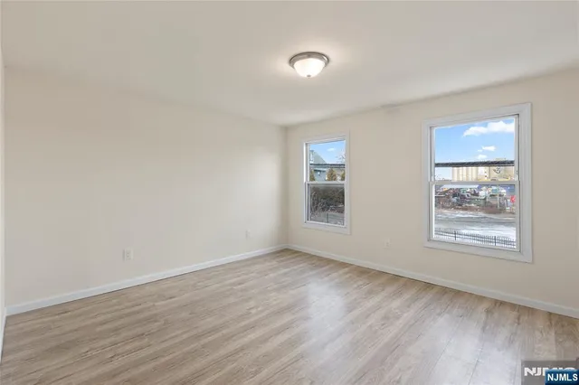 a bathroom with a toilet a sink a mirror and bathtub