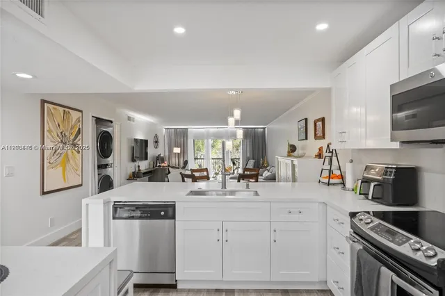 a kitchen with counter top space cabinets and stainless steel appliances
