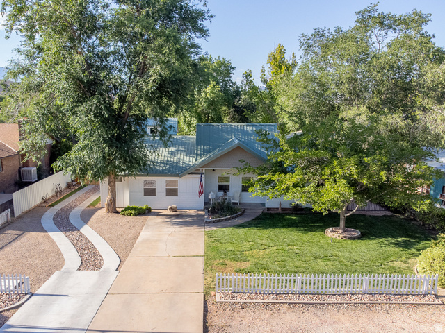 236 West 300 South Hurricane, UT 84737 - Photo 71 of 76 White exterior residence with a corrugated metal roof