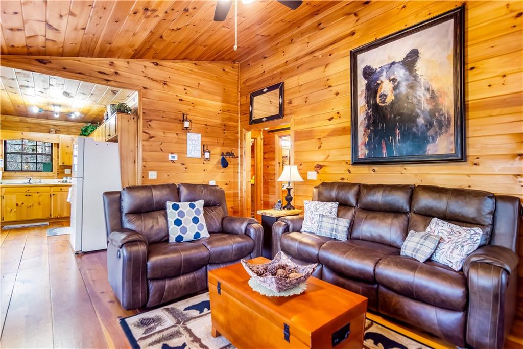 152 Broken Arrow Path Blue Ridge, GA 30513 - Photo 16 of 50 a living room with furniture and a large window