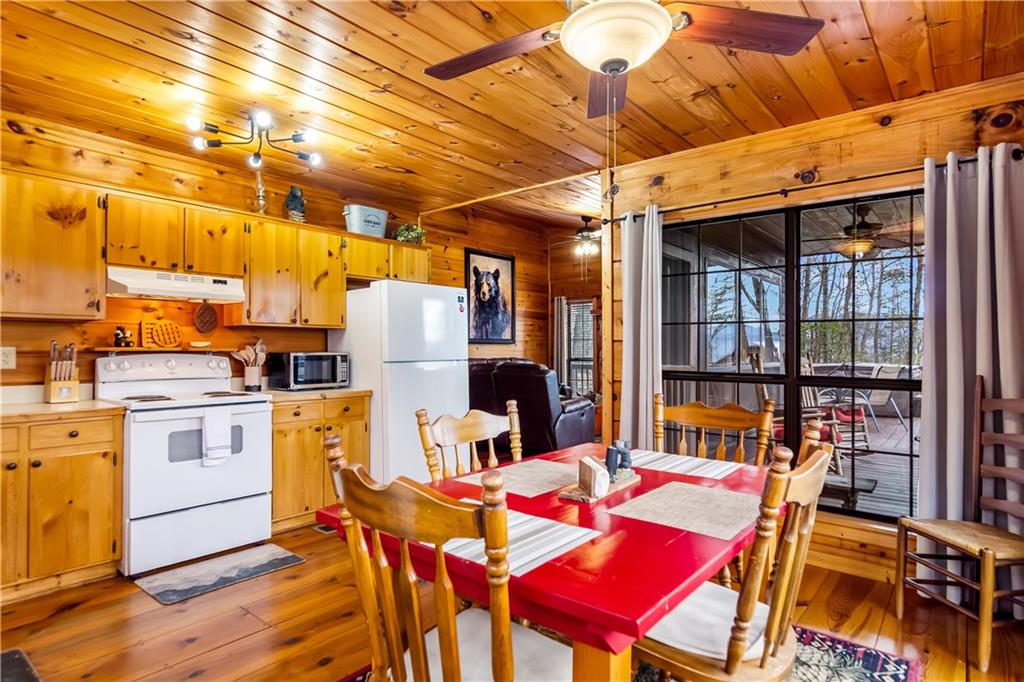 152 Broken Arrow Path Blue Ridge, GA 30513 - Photo 20 of 50 a view of a dining room with furniture and chandelier