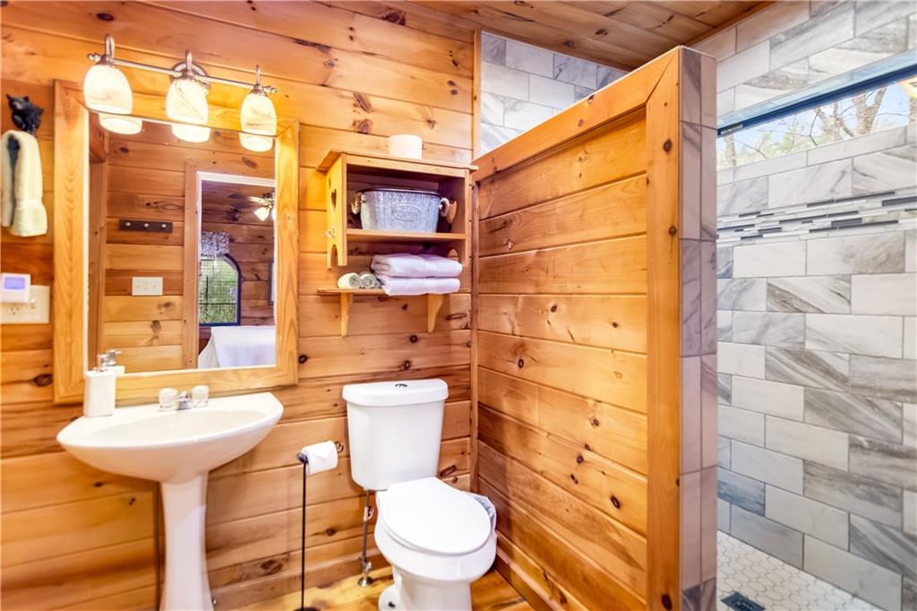 152 Broken Arrow Path Blue Ridge, GA 30513 - Photo 26 of 50 a bathroom with a sink toilet and shower