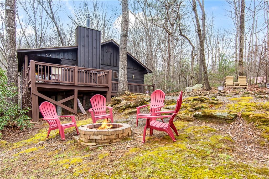 152 Broken Arrow Path Blue Ridge, GA 30513 - Photo 3 of 50 a backyard of a house with table and chairs