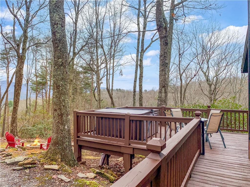 152 Broken Arrow Path Blue Ridge, GA 30513 - Photo 6 of 50 a view of a wooden deck with furniture