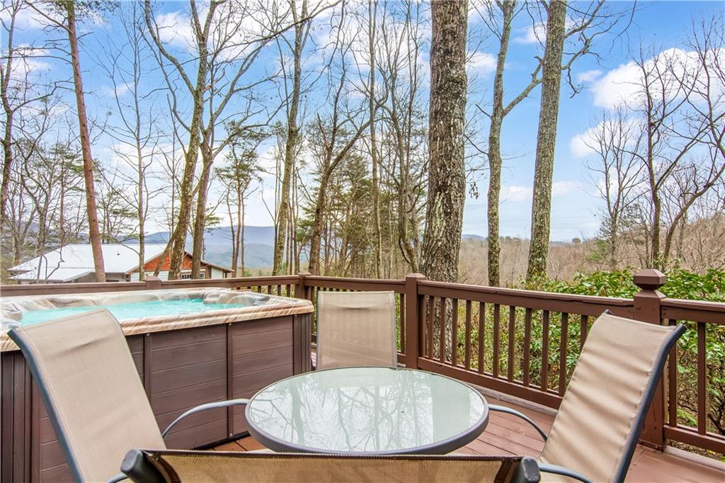 152 Broken Arrow Path Blue Ridge, GA 30513 - Photo 7 of 50 a view of a chairs and table in the balcony