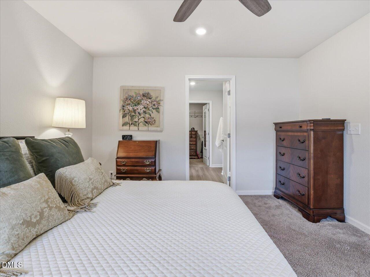 90 Barnsley Road Angier, NC 27501 - Photo 21 of 40 a bedroom with a bed and dresser
