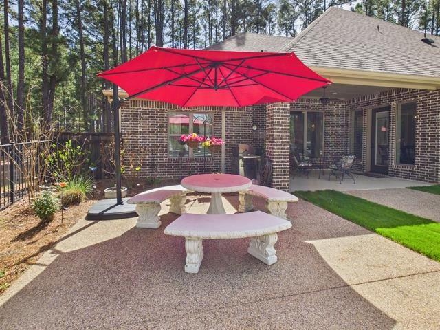 8550 Toler Pointe Larue, TX 75770 - Photo 11 of 37 a view of a backyard with a patio and garden