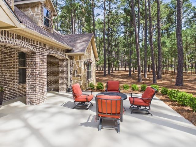 8550 Toler Pointe Larue, TX 75770 - Photo 12 of 37 a backyard of a house with outdoor seating