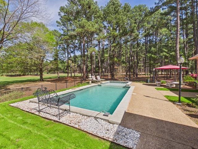 8550 Toler Pointe Larue, TX 75770 - Photo 16 of 37 a view of a swimming pool with a patio