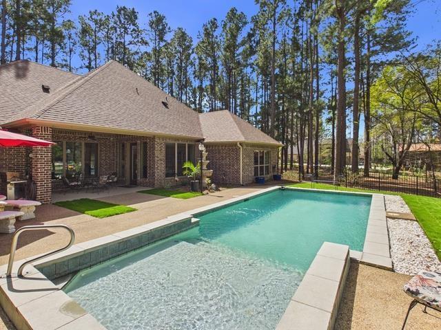 8550 Toler Pointe Larue, TX 75770 - Photo 17 of 37 a view of house with swimming pool outdoor seating