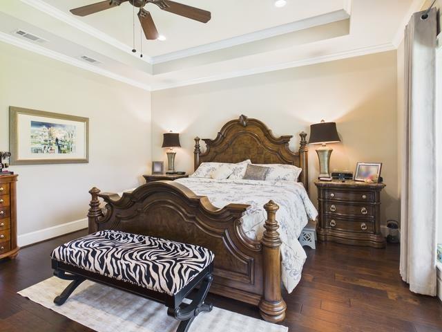 8550 Toler Pointe Larue, TX 75770 - Photo 32 of 37 a bedroom with a bed and wooden floor