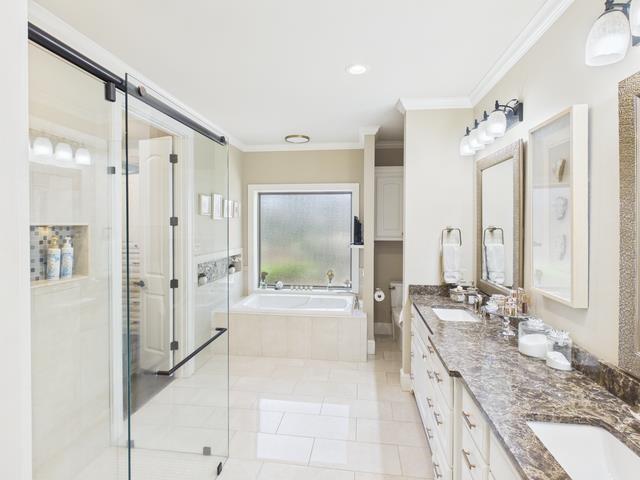 8550 Toler Pointe Larue, TX 75770 - Photo 33 of 37 a large bathroom with a granite countertop tub sink shower and a mirror