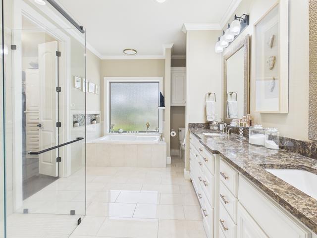 8550 Toler Pointe Larue, TX 75770 - Photo 34 of 37 a large bathroom with a granite countertop tub sink a shower and a mirror