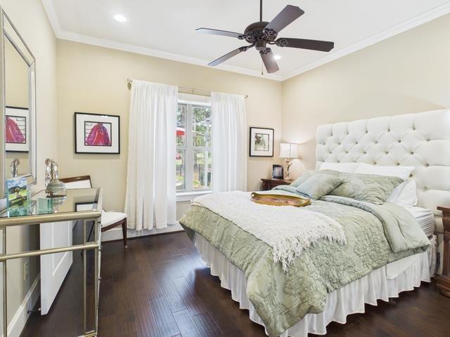 8550 Toler Pointe Larue, TX 75770 - Photo 36 of 37 a spacious bedroom with a bed and a chandelier