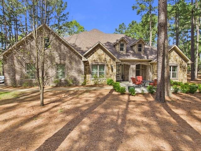 8550 Toler Pointe Larue, TX 75770 - Photo 5 of 37 a view of a house with backyard and sitting area