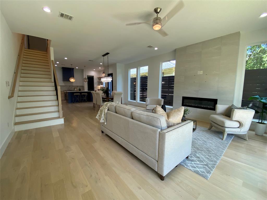 807 South Glasgow Drive Dallas, TX 75223 - Photo 10 of 25 a living room with furniture and a chandelier