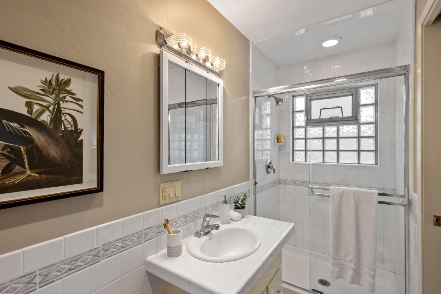 777 Parcel Street Monterey, CA 93940 - Photo 14 of 21 a bathroom with a sink vanity and a mirror